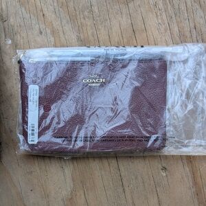 Coach Pebbled Leather Wristlet in Burgundy with Gold Accent